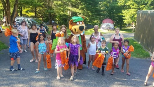 Yogi Bear with a group of kids